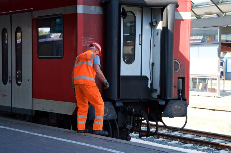 transportation working near train tracks