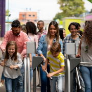 Happy group of people arriving at an amusement park