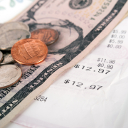 Excited black worker rewarded with money bonus for good work