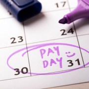 payday concept calendar with marker and circled day of salary