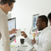 Excited black worker rewarded with money bonus for good work